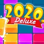 Έγχρωμοι κύβοι στοιβαγμένοι με κείμενο 2020 Deluxe στο κέντρο πάνω σε μπλε φόντο