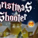 Εικόνα με την επιγραφή Christmas Shooter, φωτεινά χρωματιστά στολίδια και χειμερινό σκηνικό με σπιτάκια στο βάθος