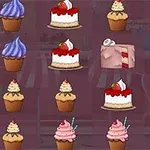 Coco in Cakeland Διάφορα γλυκά όπως cupcakes και κέικ σε πολύχρωμες επενδύσεις, τοποθετημένα σε σειρές