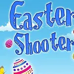 Κείμενο Easter Shooter σε γαλάζιο φόντο με σύννεφα, πολύχρωμα πασχαλινά αυγά και πεταλούδα
