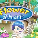 Πολύχρωμη ταμπέλα Flower Shop με ένα χαμογελαστό ξωτικό μπροστά από ανθισμένα λουλούδια, σε φόντο καταστήματος με δέντρα