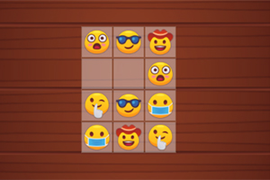 Τρίλιζα με emoji σε ξύλινο φόντο